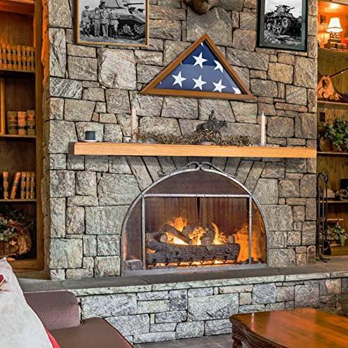 A stone fireplace features a wooden mantle with a **Jetlifee Flag Case for American Veteran Flag - Military Flag Display Case** containing a folded 9.5 x 5 Ft American flag and two white candles. Shelves with books and decorative items are on both sides.